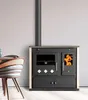 A wood-burning stove with an oven and stovetop, shown in a room setting next to a chair and table. Anteprima dell’immagine prodotto