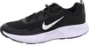A black Nike sneaker with a white sole and white Nike swoosh logo is shown against a white background. Produktbild-Vorschau