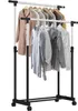A double-bar garment rack with various clothes hanging on it. Anteprima dell’immagine prodotto