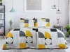 A neatly made bed with geometric patterned bedding in a bright room. Náhľad obrázku produktu