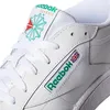 A close-up view of a white Reebok Club 85 sneaker, showing the laces, tongue, and side logo. Voir les images du produit