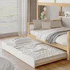 A children's bunk bed with a pull-out trundle bed, set up in a bedroom with blinds and curtains. Náhľad obrázku produktu