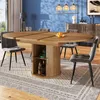A dining room scene with a round extendable table and chairs. Anteprima dell’immagine prodotto