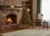 A cozy living room scene with a fireplace, Christmas tree, and rocking chair. Voir les images du produit