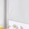 A close-up view of a white sheer roller blind with vertical stripes, partially covering a window with daisies and other flowers visible below. Produktbild-Vorschau