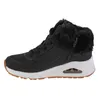 A side view of a black Skechers sneaker with a white sole and brown trim. Voir les images du produit