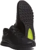 A pair of black leather sneakers shown from a slightly elevated angle, with one shoe in the foreground and the other behind it. Podgląd zdjęcia produktu
