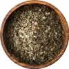 A close-up overhead view of dried za'atar spice blend in a wooden bowl. Produktbild-Vorschau