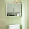 A wall-mounted cabinet with two doors above an open shelf, placed above a toilet. Náhled obrázku produktu