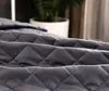 Close-up of a quilted gray blanket. Podgląd zdjęcia produktu