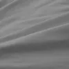 A close-up, abstract view of grey fabric with soft folds and creases, suggesting a textile product like bedding. Produktbild-Vorschau
