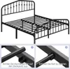 A black metal bed frame with a decorative headboard is shown against a white background. Two inset images demonstrate assembly steps. Produktbild-Vorschau
