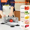 A person is using a commercial tomato slicer to slice a tomato. The image also shows examples of other foods that can be sliced. Produktbild-Vorschau