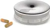 A pillbox with two pills next to it. Produktbild-Vorschau