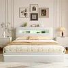 A modern white bed with LED lighting and storage in a bedroom setting. Produktbild-Vorschau