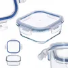 Multiple views of glass food storage containers with blue lids. Produktbild-Vorschau