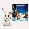 A plush toy rabbit with Christmas lights and an advent calendar book. Produktbild-Vorschau