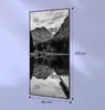 A black and white image of a framed landscape artwork depicting mountains and a lake, with dimensions indicated by text. Produktbild-Vorschau