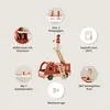 A wooden fire truck toy with accessories and figures, surrounded by feature callouts. Produktbild-Vorschau