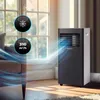 A portable air conditioner is shown in a room with natural light coming from a window. Produktbild-Vorschau