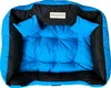 A blue and black dog bed with two small pillows. Náhled obrázku produktu