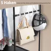 A clothing rack with shirts, a handbag, and a cap displayed on hooks. Produktbild-Vorschau