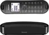 A black Panasonic cordless phone and its charging base are shown against a white background. Produktbild-Vorschau