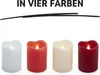 Four LED candles in different colors are displayed in a row against a white background. Produktbild-Vorschau