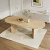 A dining room scene with a wooden oval dining table on a rug, in front of a sideboard. Anteprima dell’immagine prodotto