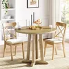 A round wooden dining table with two chairs in a well-lit room, with a bookshelf in the background. Produktbild-Vorschau