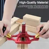 A person's hands are using a red woodworking groove plane on pieces of wood. Produktbild-Vorschau