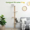 A cat climbing a tall, multi-tiered cat tree next to a potted plant and a sofa. Náhled obrázku produktu
