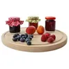 Three small jars of jam with fruit on a wooden board. Anteprima dell’immagine prodotto