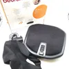 A Beurer foot massager and its accessories are laid out on a white surface, with part of the product packaging visible in the background. Produktbild-Vorschau