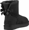 A black Ugg boot with a bow on the back. Produktbild-Vorschau