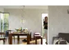 A dining room scene with a table set for a meal and a woman entering with a bowl. Produktbild-Vorschau