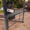 An outdoor patio scene with a grill and a bar setup. Anteprima dell’immagine prodotto