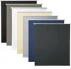 A collection of roller blinds in various colors, arranged in a staggered formation. Produktbild-Vorschau