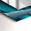 A close-up view of a decorative wall mirror with a printed image of green leaves. Produktbild-Vorschau