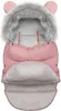 A pink baby sleeping bag with a faux fur-lined hood and bear ears. Produktbild-Vorschau