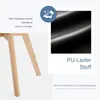 Close-up of chair legs and a swatch of black PU leather material, with text highlighting product features. Náhled obrázku produktu
