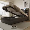 A bedroom scene with a bed frame open to reveal storage space. Náhľad obrázku produktu