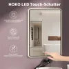 A hand touching a touch-sensitive button on a modern LED bathroom mirror. Anteprima dell’immagine prodotto