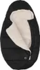 A black baby sleeping bag with a cream-colored fuzzy interior, laid out flat. Produktbild-Vorschau