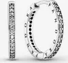 A pair of silver hoop earrings with clear stones and engraved text. Anteprima dell’immagine prodotto