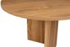 A close-up view of a wooden table with a rounded edge and a pedestal base. Voir les images du produit