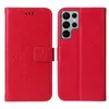 A red flip phone case with a floral and butterfly design is shown open and closed. Produktbild-Vorschau