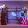 A gaming loft bed setup with a desk, chair, and computer, illuminated by neon lights. Podgląd zdjęcia produktu