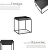 A product image featuring a black metal side table with text describing its design and construction. Produktbild-Vorschau