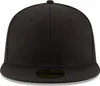 A plain black fitted cap is shown from the front. Produktbild-Vorschau